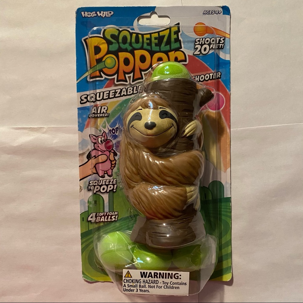 Hog Wild Squeeze Popper Sloth Action Figure + 4 Soft Balls
